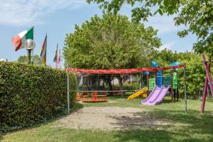 a park with a playground with a slide at Residence Villaggio Tiglio in Sirmione