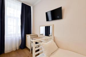 TV a/nebo společenská místnost v ubytování Stabu Sēta Residence