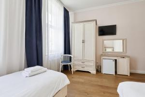 Postel nebo postele na pokoji v ubytování Stabu Sēta Residence