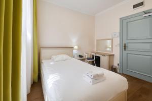 Postel nebo postele na pokoji v ubytování Stabu Sēta Residence