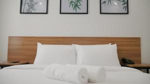 Postel nebo postele na pokoji v ubytování Bambu Suites