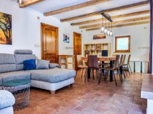 a living room with a couch and a table at Jakob Cabin in Bovec