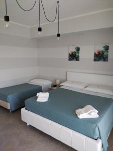 Letto o letti in una camera di Sand Hotel
