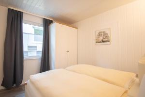 Postel nebo postele na pokoji v ubytování Tiny-Bungalow - zum Strand 50m + 5 fotografií