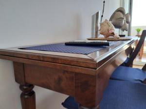 a ping pong table with a dog toy on top of it at Apartamento 108 Hotel Flamero in Matalascañas
