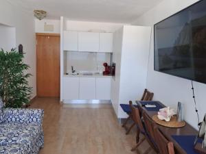 TV a/nebo společenská místnost v ubytování Apartamento 108 Flamesol