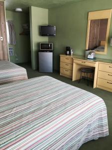 Postel nebo postele na pokoji v ubytování Caribbean Motel