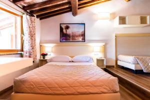 Postel nebo postele na pokoji v ubytování Hotel Corso