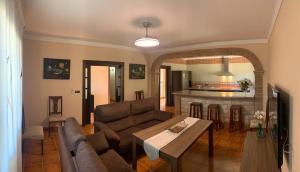 a living room with a couch and a table at Casa de María in Valle de Abdalagís