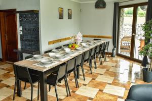 a long dining room with a long table and chairs at Apartamenty EverySky Gasthaus Karpacz in Karpacz