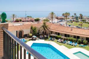 a view of the pool from the balcony of a resort at JAZMÍN 24 in Torremolinos