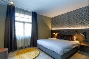 Gulta vai gultas numurā naktsmītnē DAS Hotel by Hopfenschlingel