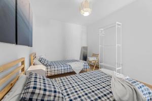 En eller flere senge i et værelse på Home2Book Charming Apartment Tinajo, Wifi