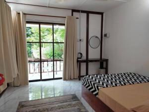 Postel nebo postele na pokoji v ubytování D'Impiana Riverview Chalet # Lenggong