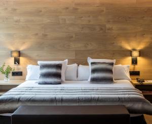 Кровать или кровати в номере Acta Arthotel