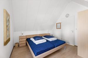 Postel nebo postele na pokoji v ubytování Hello Zeeland - Vakantiehuis Stern 194