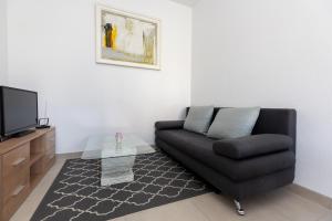 A seating area at Apartment Ana