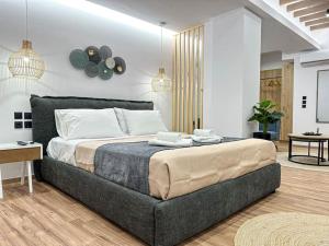 a bedroom with a large bed in a room at Oasis Luxury Apartments in Eretria