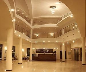 a large lobby with a hotel sign in it at Ośrodek Wypoczynkowy Ariston in Miłków +11 photos