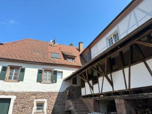 an old building with windows and a roof at Metzlinschwander Hof in Marxzell