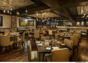 a restaurant with tables and chairs in a room at Golden Nugget Lake Tahoe in Stateline