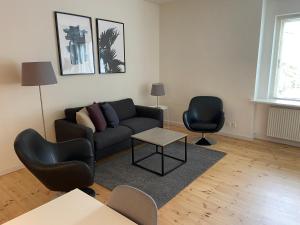 Uma área de estar em Vesterbro Apartments 8