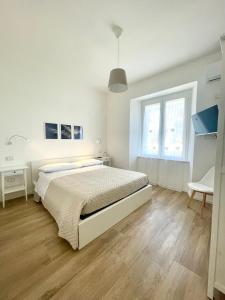 Postel nebo postele na pokoji v ubytování Asso Asso