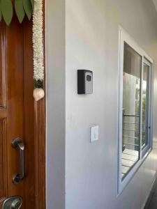 a door with a window next to a balcony at SSN Home Stays in Bangalore near PLAY Arena in Bangalore