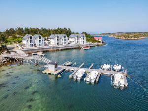 an aerial view of a marina with boats in the water at Atlanterhavsveien Rorbuer in Averoy