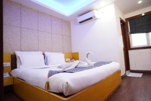 Postel nebo postele na pokoji v ubytování Hotel Emirates