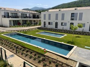an aerial view of the courtyard of a building with a swimming pool at FOU DU VENTOUX in Malaucène