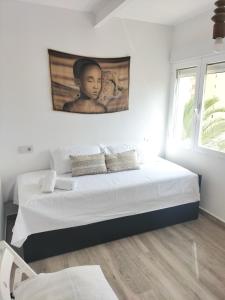 A bed or beds in a room at Apartamento Alma de Mar, increíble vistas!!