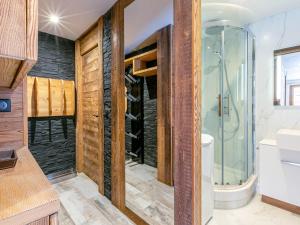 a bathroom with a shower and a toilet and a sink at Appartement Val-d'Isère, 3 pièces, 5 personnes - FR-1-519-22 in Val-d'Isère