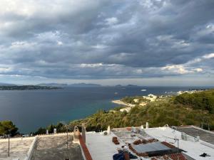 a view of the ocean from a building at Villa House 200 with sea view in Spetses
