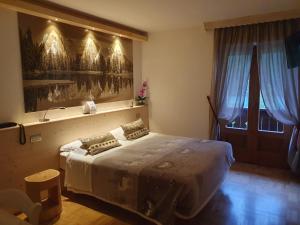 Postel nebo postele na pokoji v ubytování Albergo Meublè Victoria
