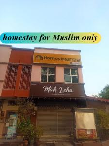 a building with a sign for ahmgiene for muslin only at Rizqy Homestay di Jitra in Jitra