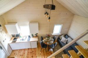 an overhead view of a living room and kitchen in a tiny house at Pogodny domek in Kołczewo