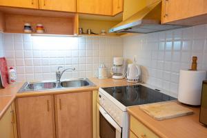 A kitchen or kitchenette at Beachfront Studio with Private Path to the Sea