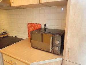 A kitchen or kitchenette at Beachfront Studio with Private Path to the Sea
