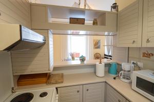 A kitchen or kitchenette at Beachfront Studio with Private Path to the Sea