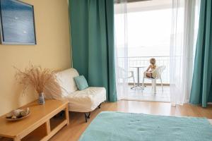 A bed or beds in a room at Beachfront Studio with Private Path to the Sea