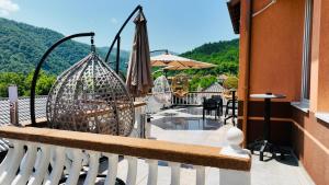 a balcony with a view of a mountain at Hotel Casablanca in Goražde