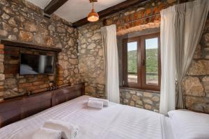Posteľ alebo postele v izbe v ubytovaní Pool Villa Cupido - Happy Rentals