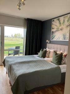 Posteľ alebo postele v izbe v ubytovaní Bedinge Golfklubb hotell