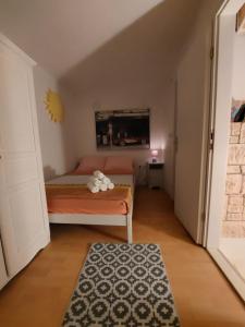 Postel nebo postele na pokoji v ubytování Apartment Stella