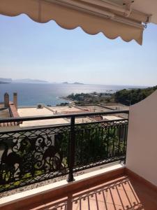 a balcony with a view of the ocean at Villa House 200 with sea view in Spetses