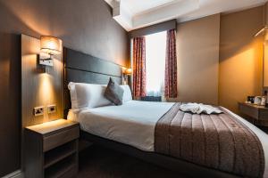 Krevet ili kreveti u jedinici u objektu Brunel Hotel