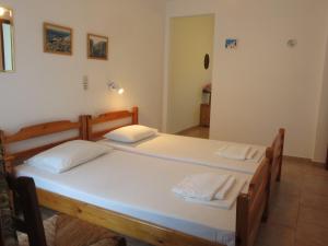 Postel nebo postele na pokoji v ubytování Panagiotis Apostoloudias Rooms + 16 fotografií