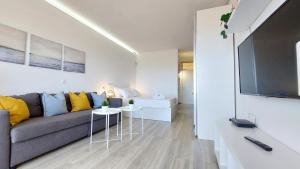 A television and/or entertainment centre at Ocean Blue Deluxe Jandia by Sea You There Fuerteventura