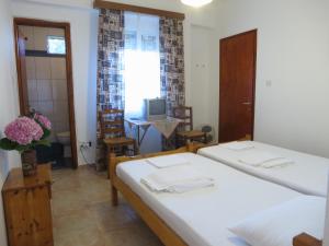 Postel nebo postele na pokoji v ubytování Panagiotis Apostoloudias Rooms